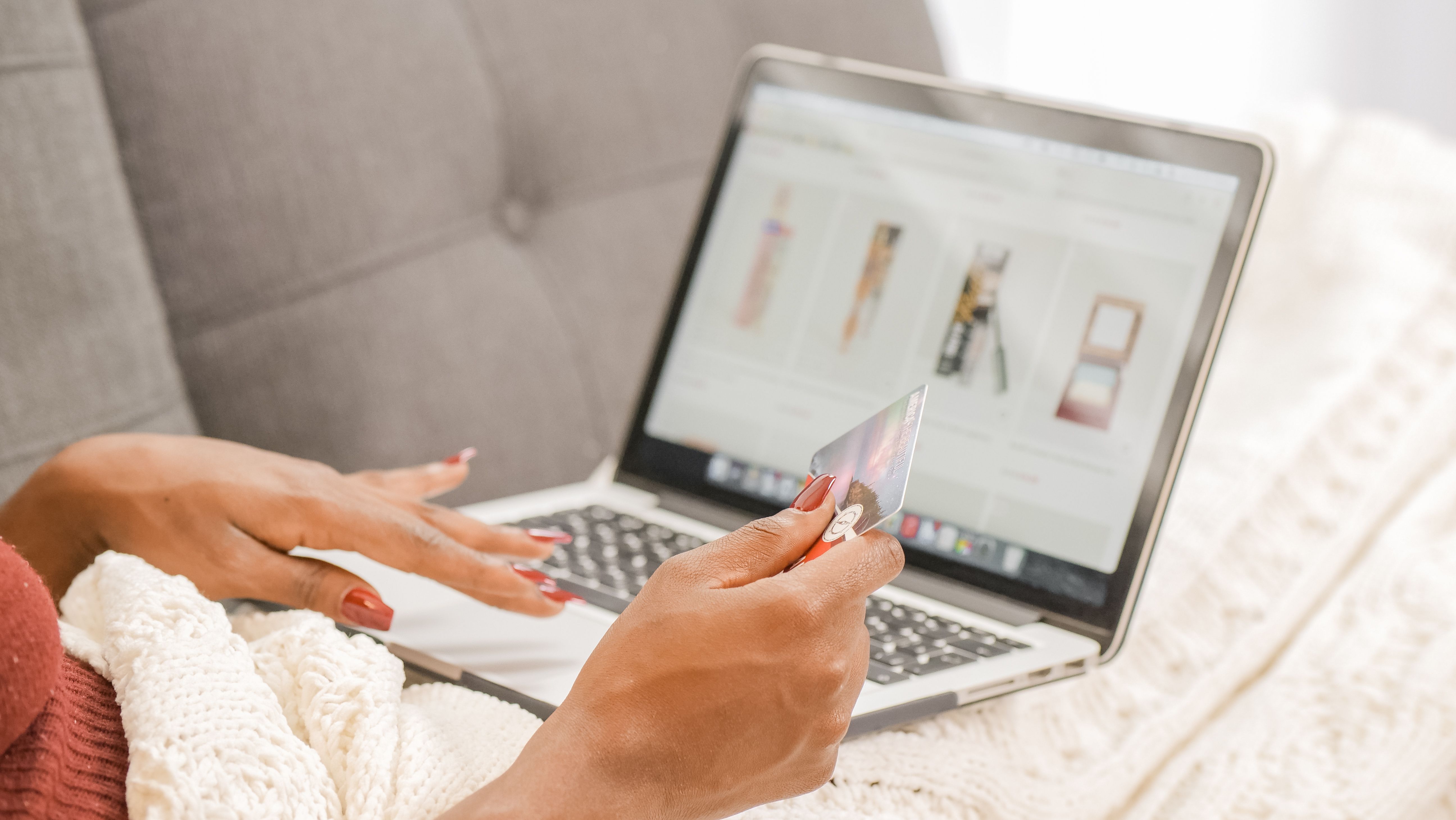Person browsing deals on laptop at home