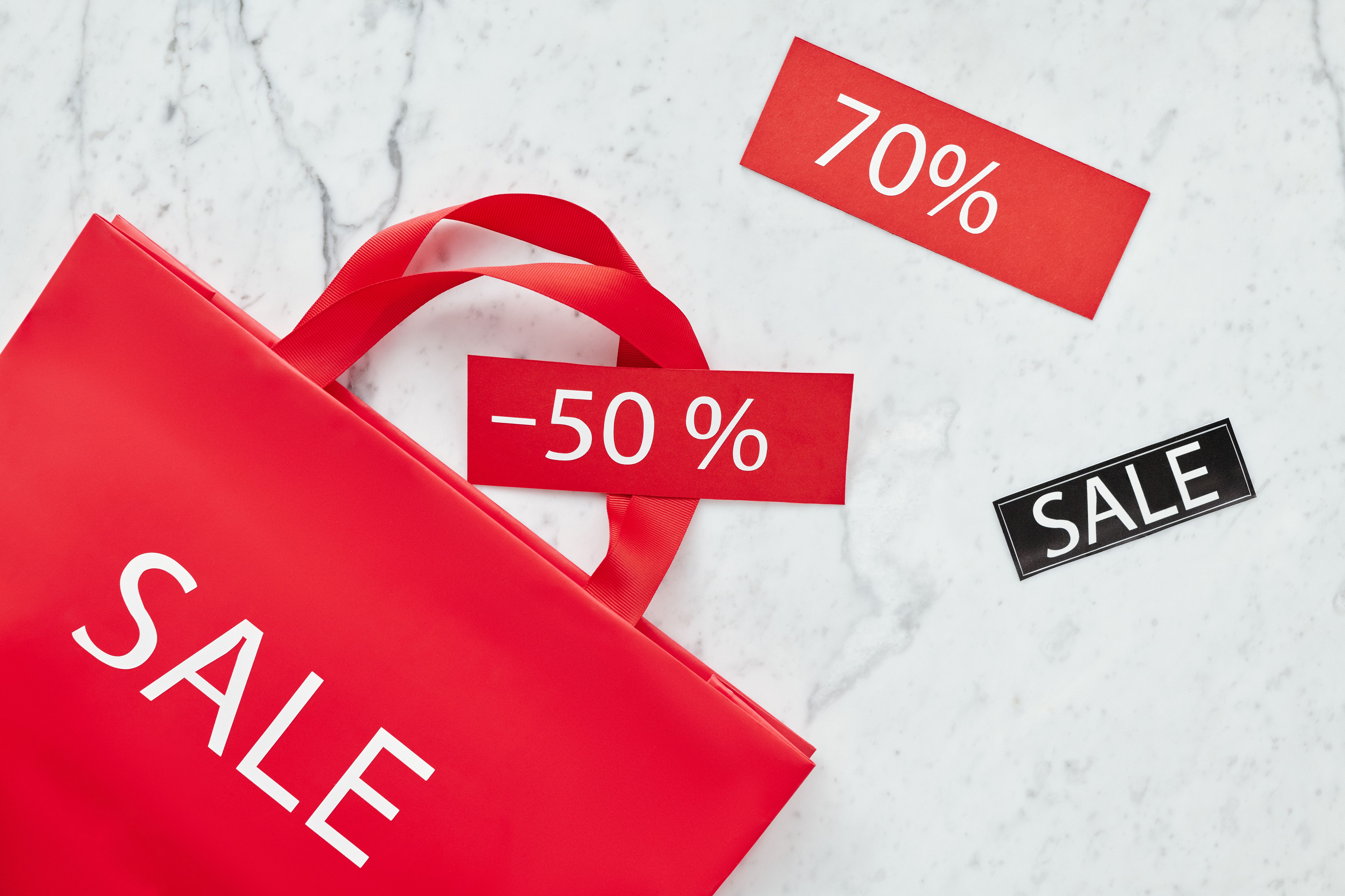 Close-up of discount percentage tags