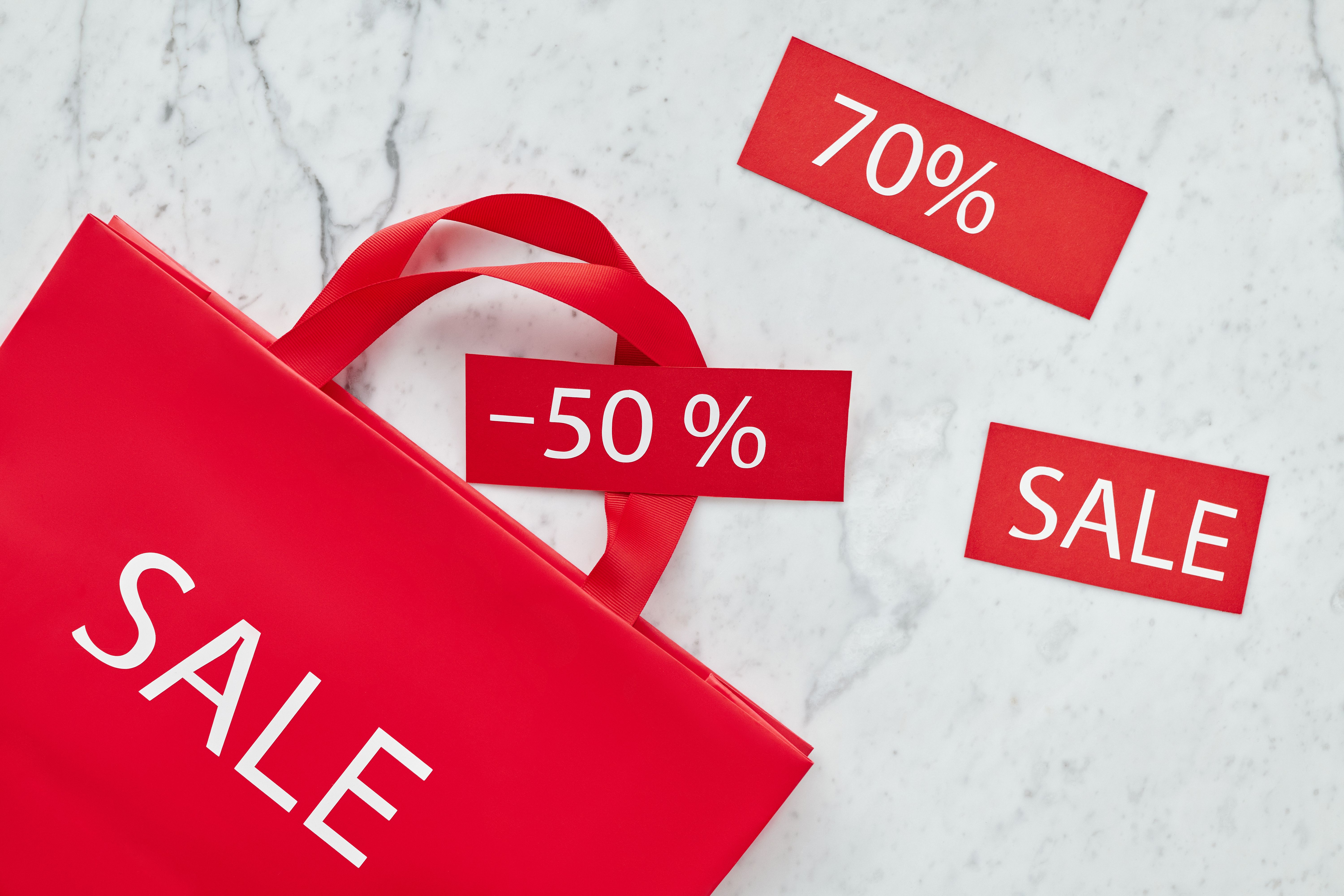 Red shopping bag with discount tags